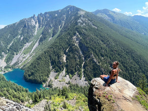 Sitting on rock overlooking Lindeman Lake in Chilliwack, British Columbia
